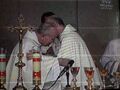 Cardinal Jaworski and Cardinal Bertone exchange sign of peace